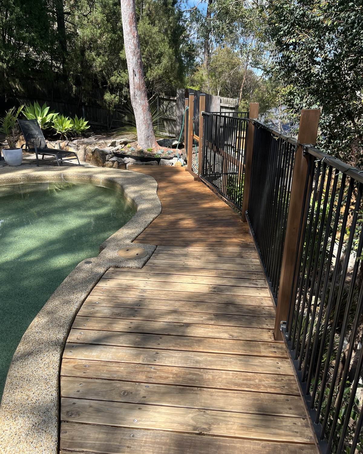 Weathered, faded grey timber pool deck in Mount Colah before sanding and restaining